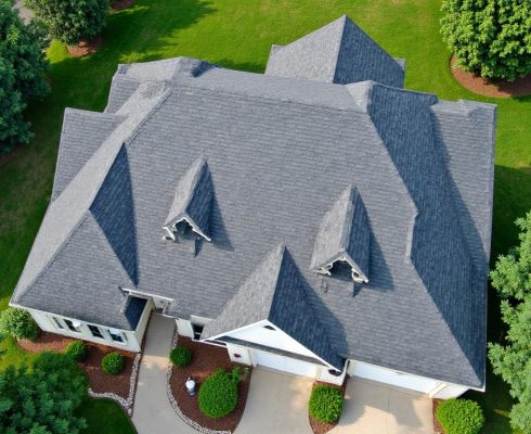New asphalt shingle roof installed by GAF-certified roofing contractor in Aubrey TX, highlighting clean lines and ridge venting.
