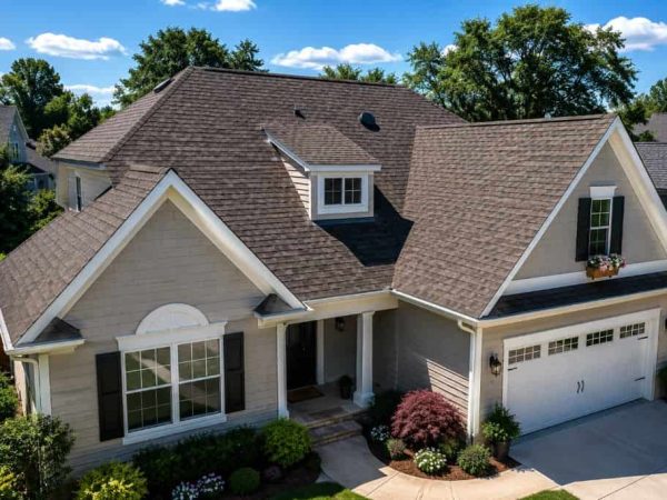 Residential home with a newly installed architectural shingle roof by a roofing contractor in Richland Hills, TX.