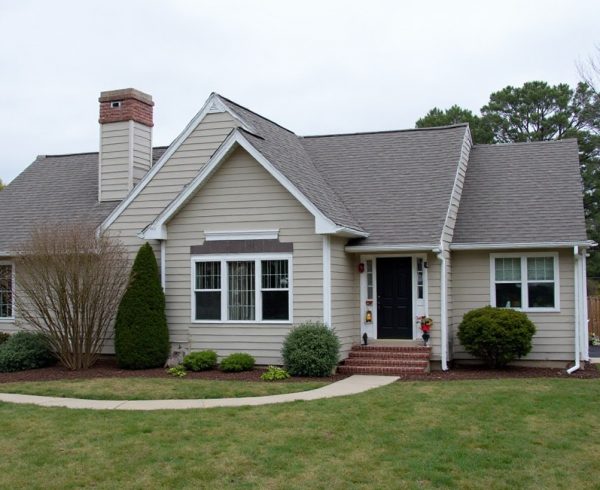 Roofing contractor handling an active residential roofing project in Grand Prairie, TX.
