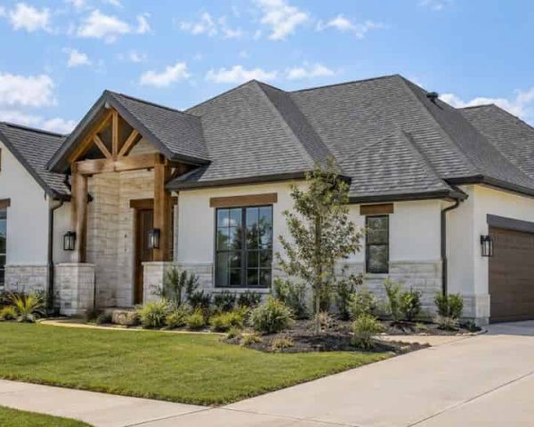 Modern home with an architectural shingle roof featuring multiple hips, ridges, and roof sections.